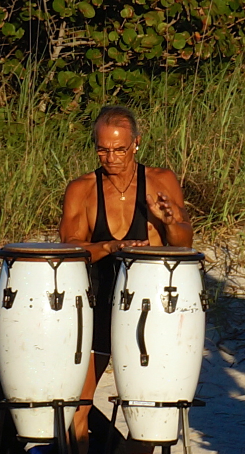 a dancing, blessing, drummer