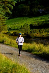 Patricia running along the Glendsan in Glendalogh